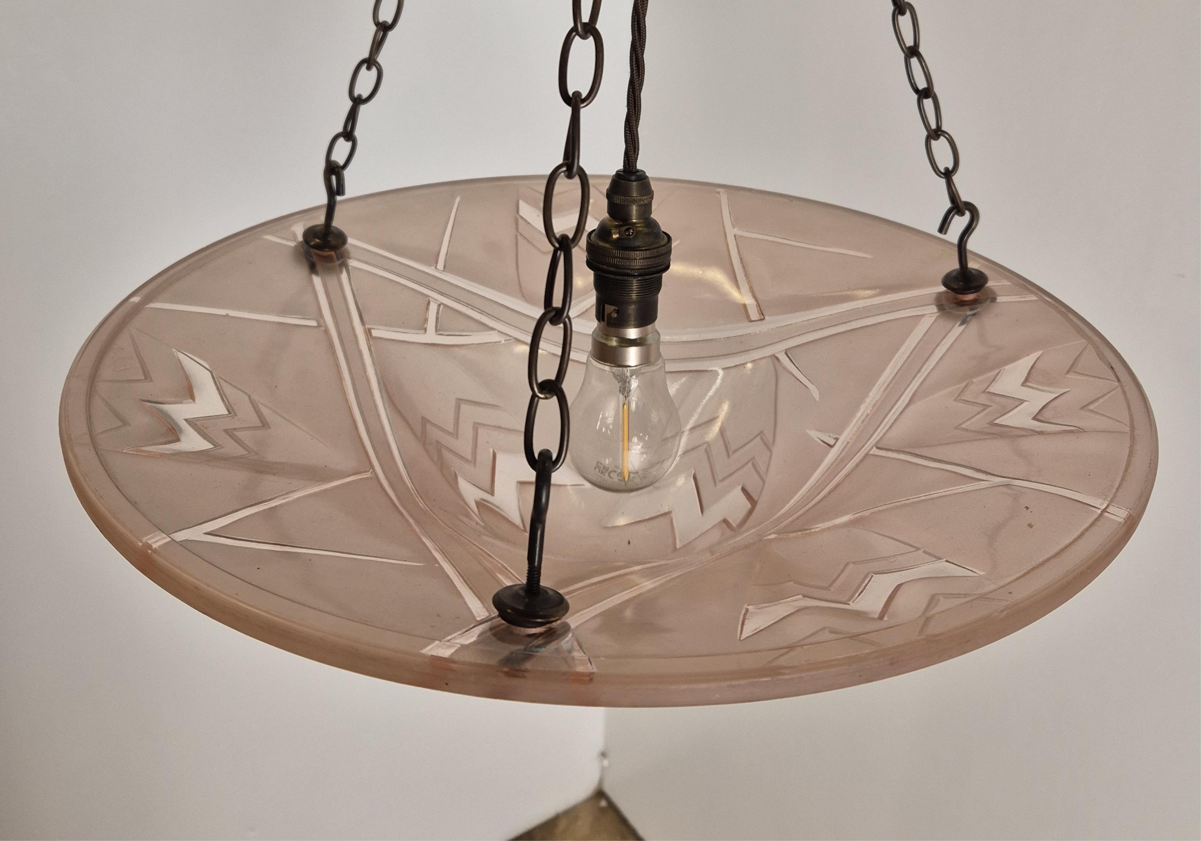 A French pink glass plaffonier ceiling lamp signed “Degue” with antique brass fitting, circa 1920’s–1930’s, wired, glass 38cm diameter, 12cm deep. Condition - good, not tested